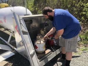 Homestead Coal owner filling a propane tank